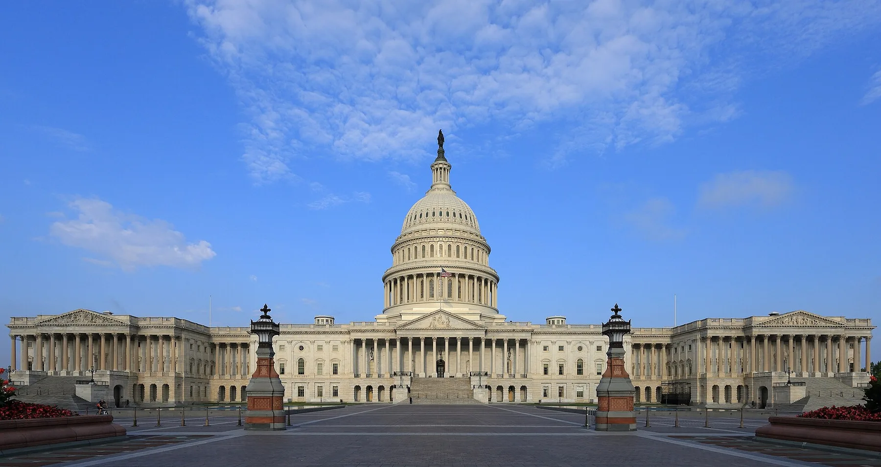 The US Capitol building in Washington, home of Congress, under a blue sky with light clouds
