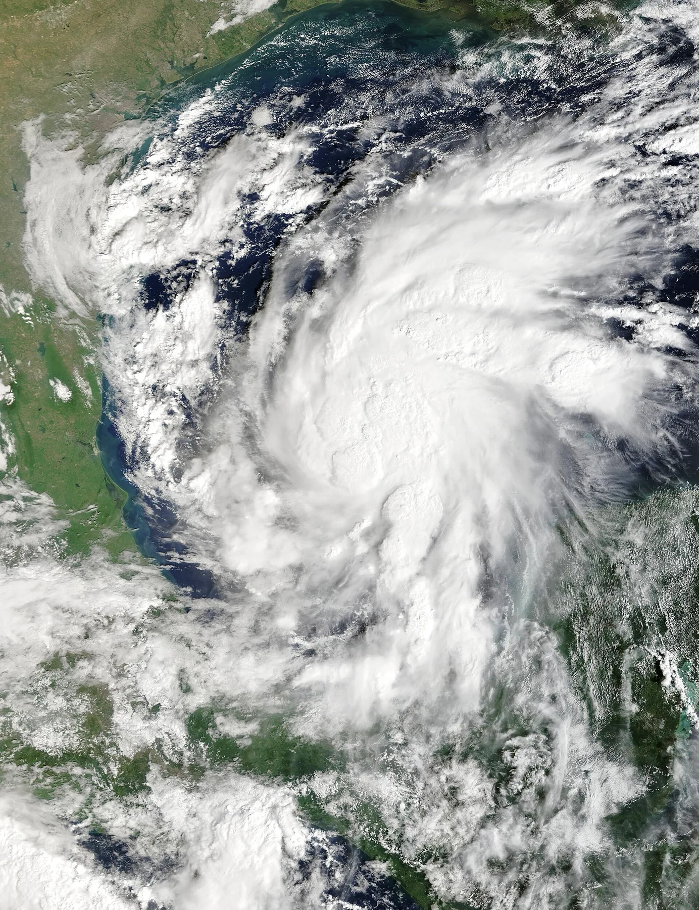 Satellite view of Isaias as a large swirl of white cloud over the Gulf of Mexico on 7 October 2026