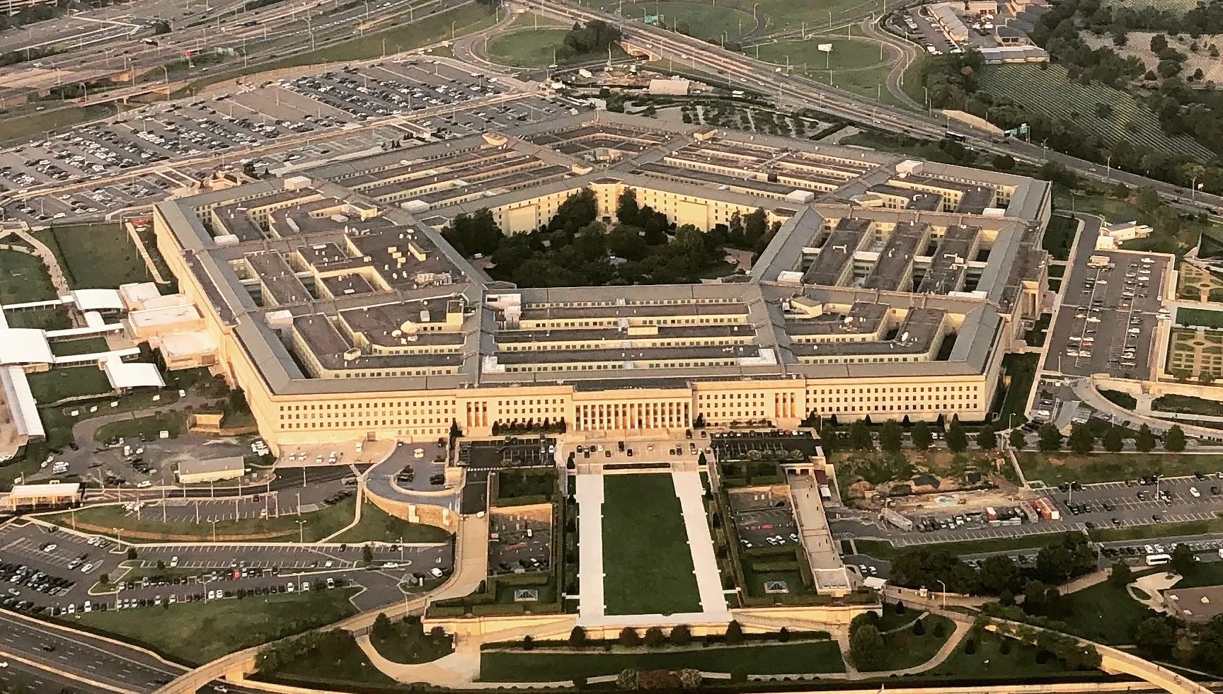 Aerial view of the five-sided Pentagon building in Arlington, Virginia, with car parks around it