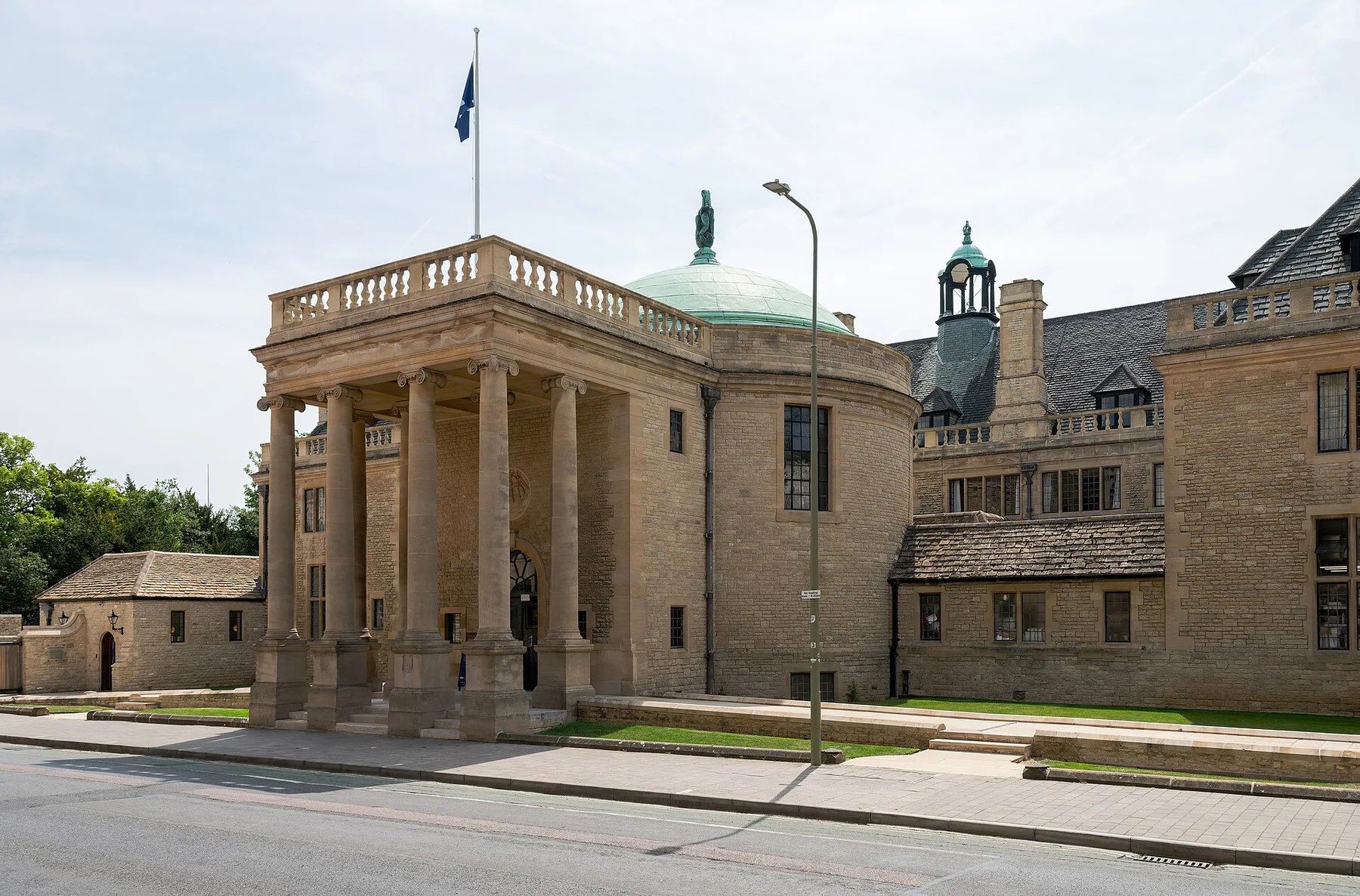 Rhodes House in Oxford, a stone building with columned portico and green dome