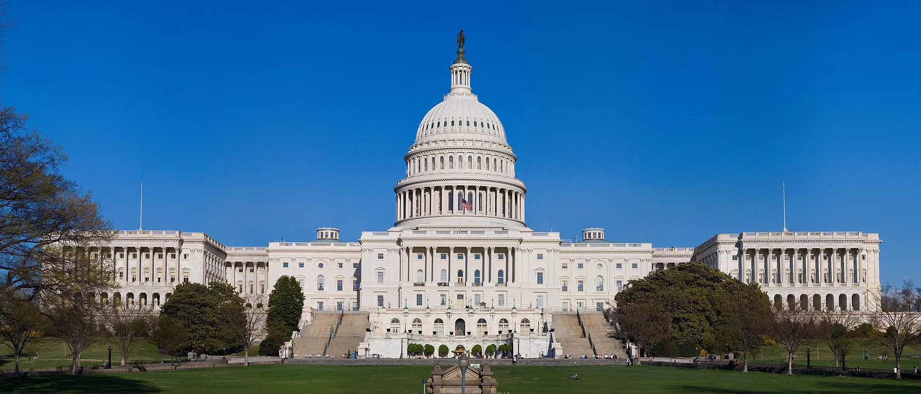 The US Capitol building in Washington with its white dome under a clear blue sky