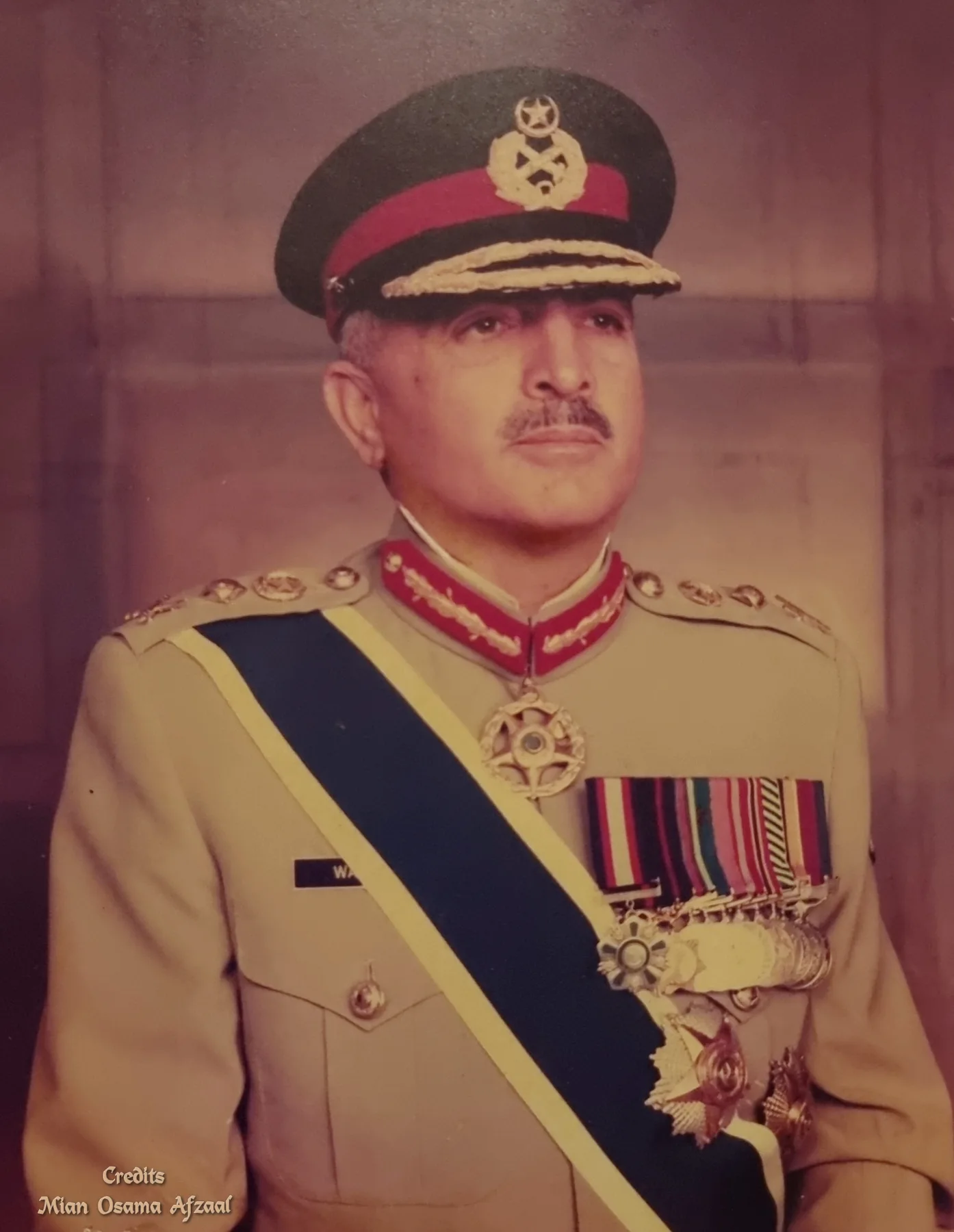 Official portrait of General Abdul Waheed Kakar in army dress uniform with sash, medals and peaked cap