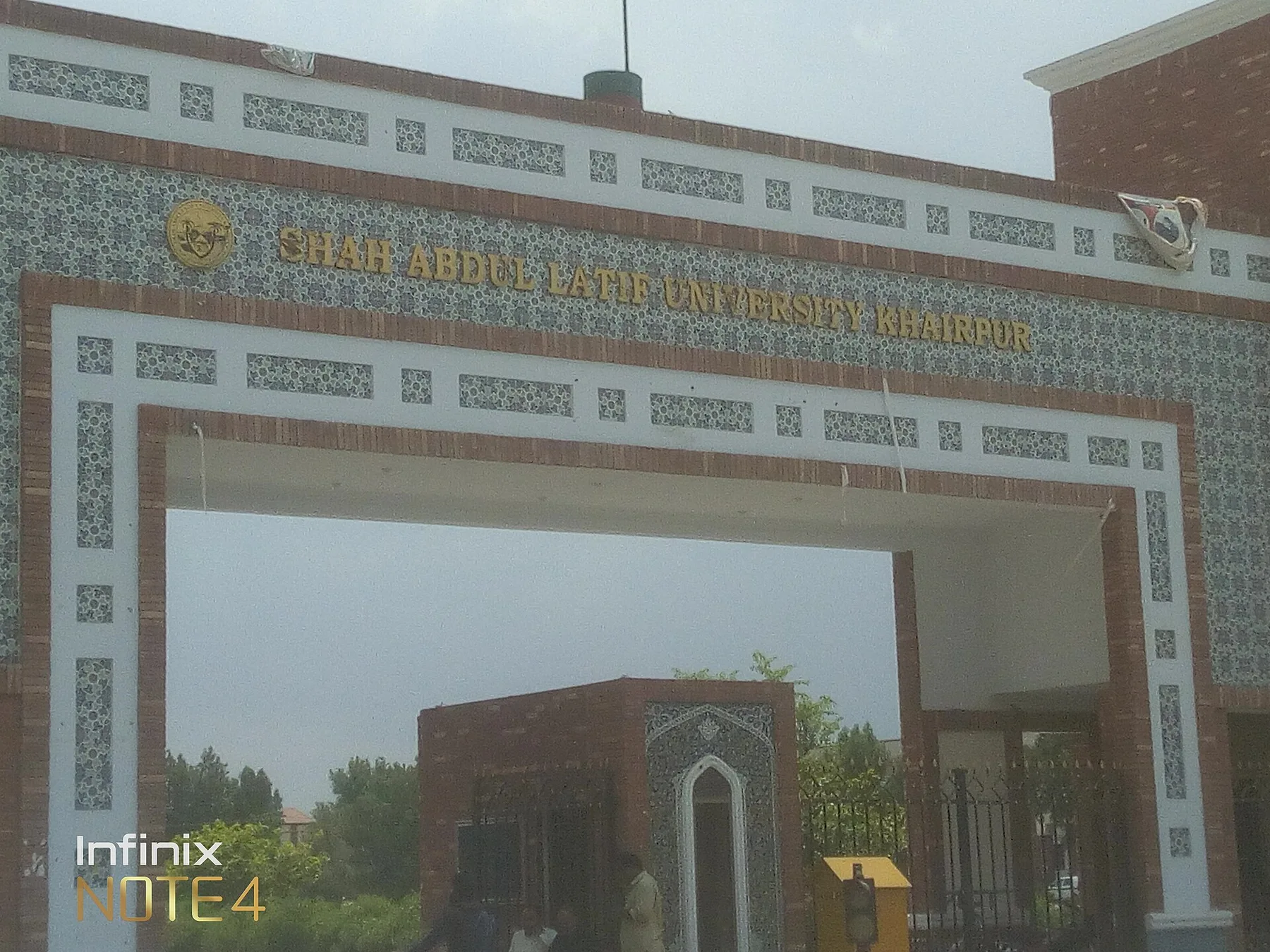 Tiled main gate of Shah Abdul Latif University Khairpur with its name in gold letters