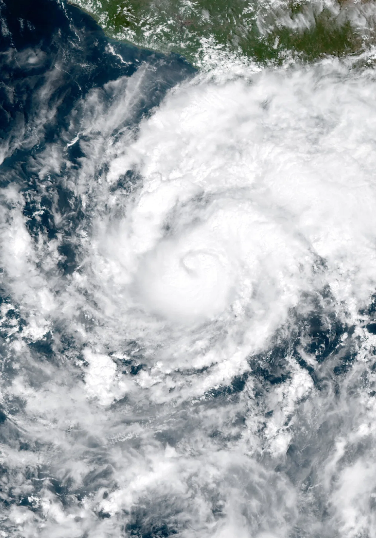 Satellite view of Hurricane Trudy, a swirl of white cloud off the southwest coast of Mexico on 15 October