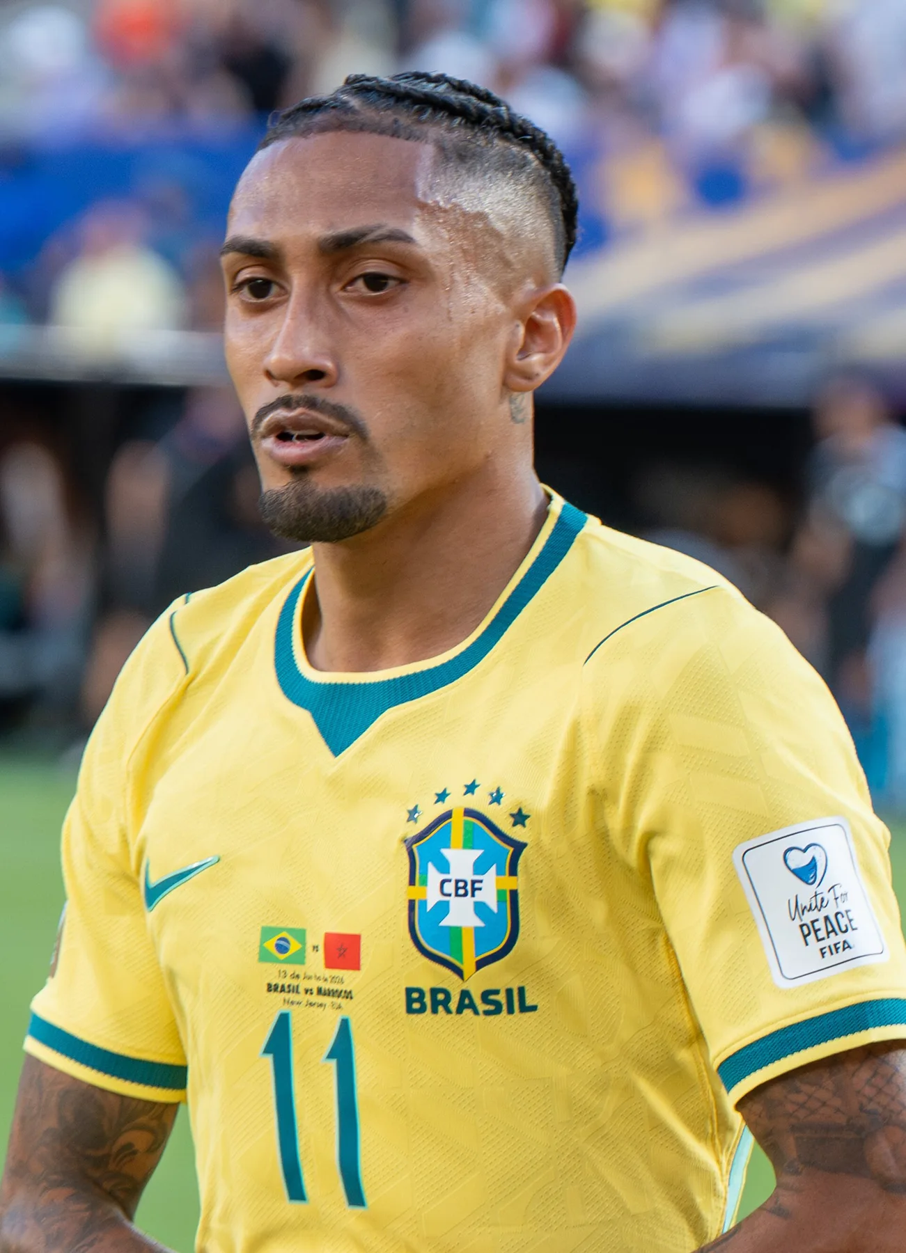 Raphinha in Brazil yellow number 11 shirt on the pitch before a match