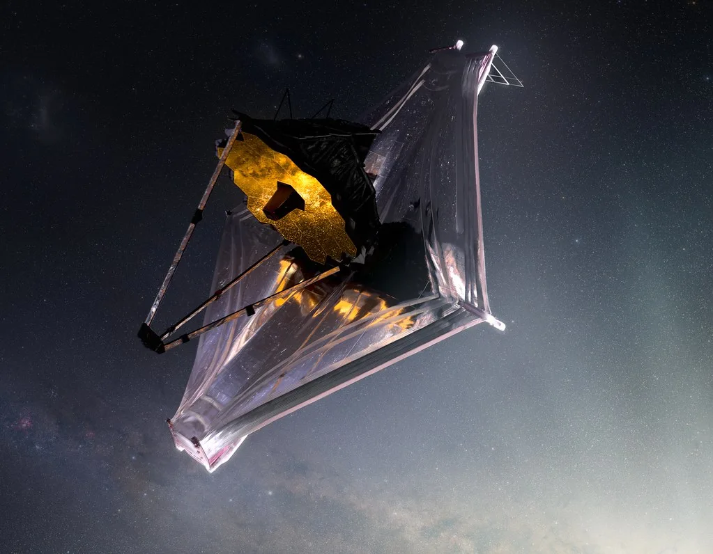 Artist rendering of the James Webb Space Telescope with its gold mirror and silver sunshield in space