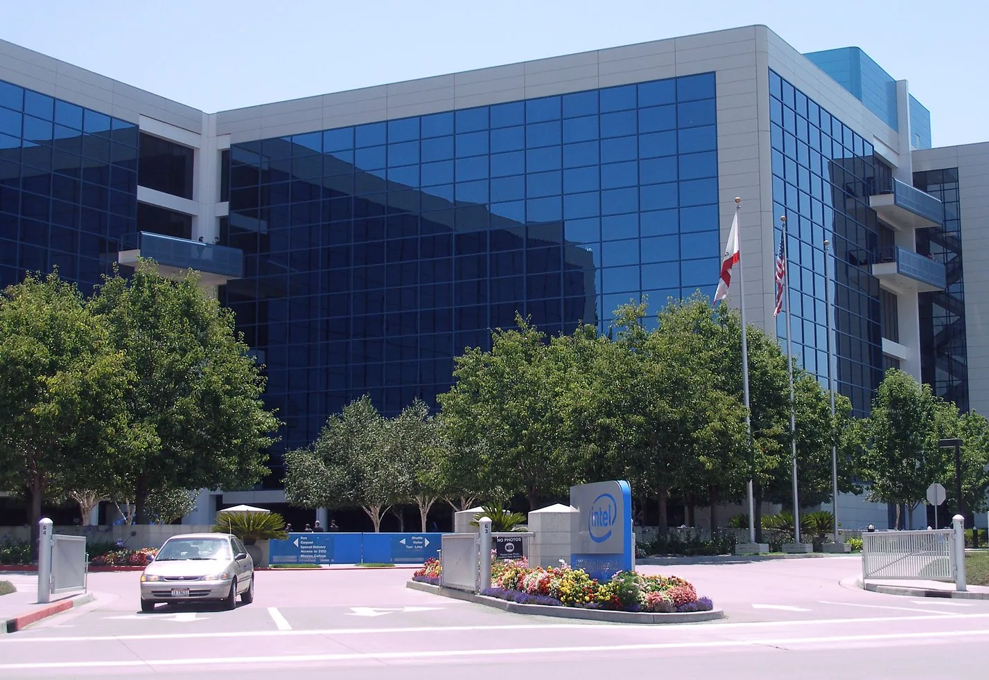 Intel headquarters glass office building in Santa Clara with the Intel logo sign at the entrance