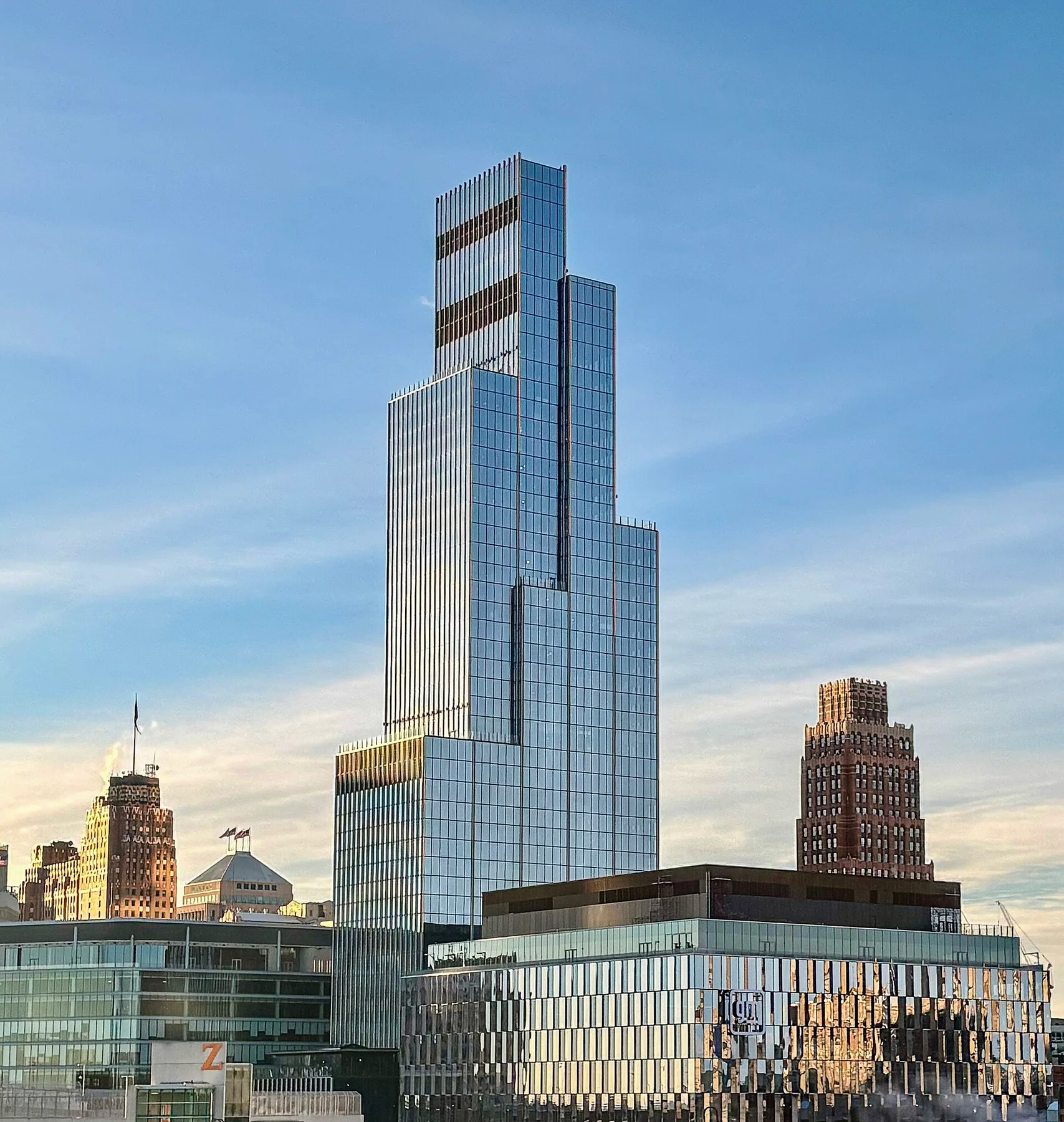 Glass Hudson's Detroit tower, where General Motors has its headquarters, rising above low buildings